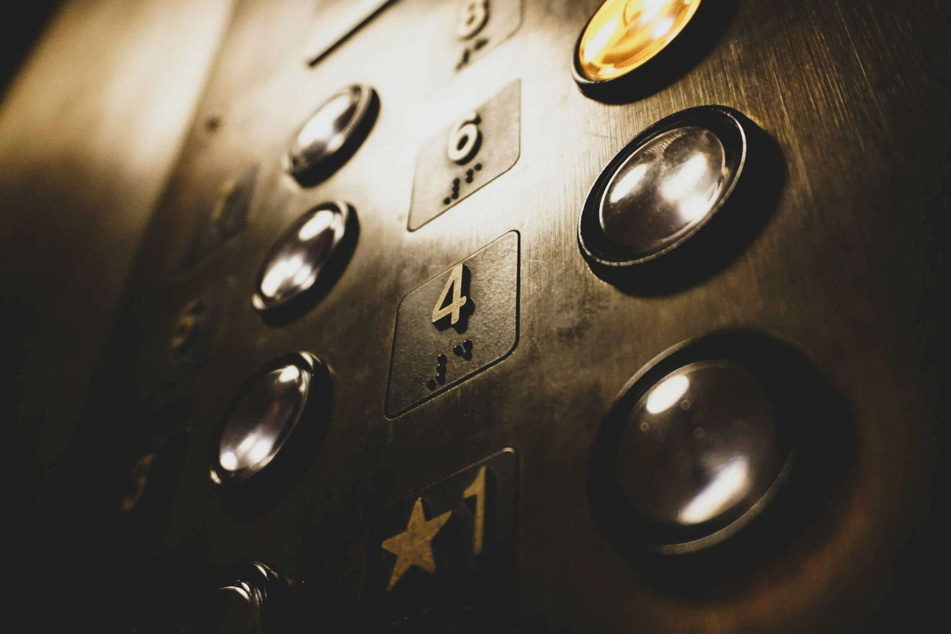 close-up photo of elevator push buttons